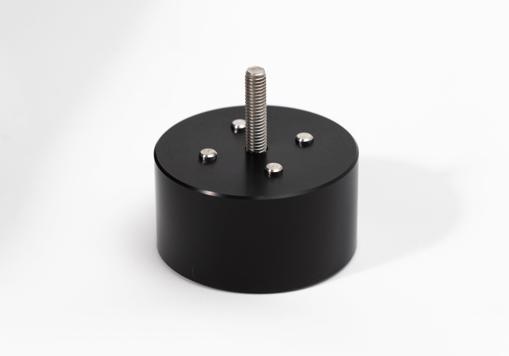 Black cylindrical turntable base with threaded mounting post and screws