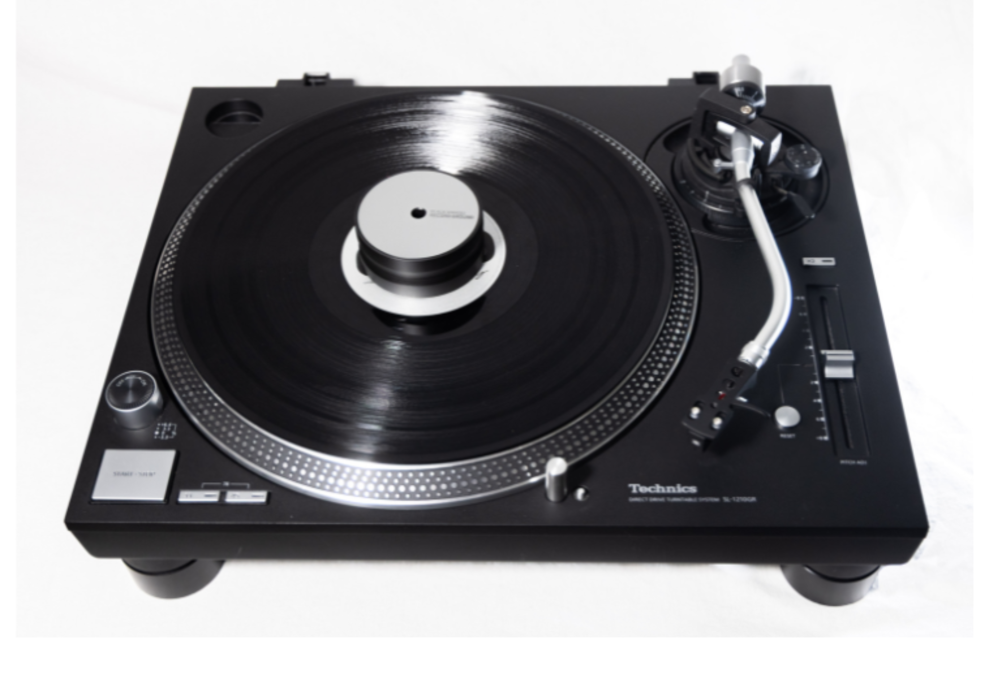 Black vinyl turntable with platter, tonearm, and controls