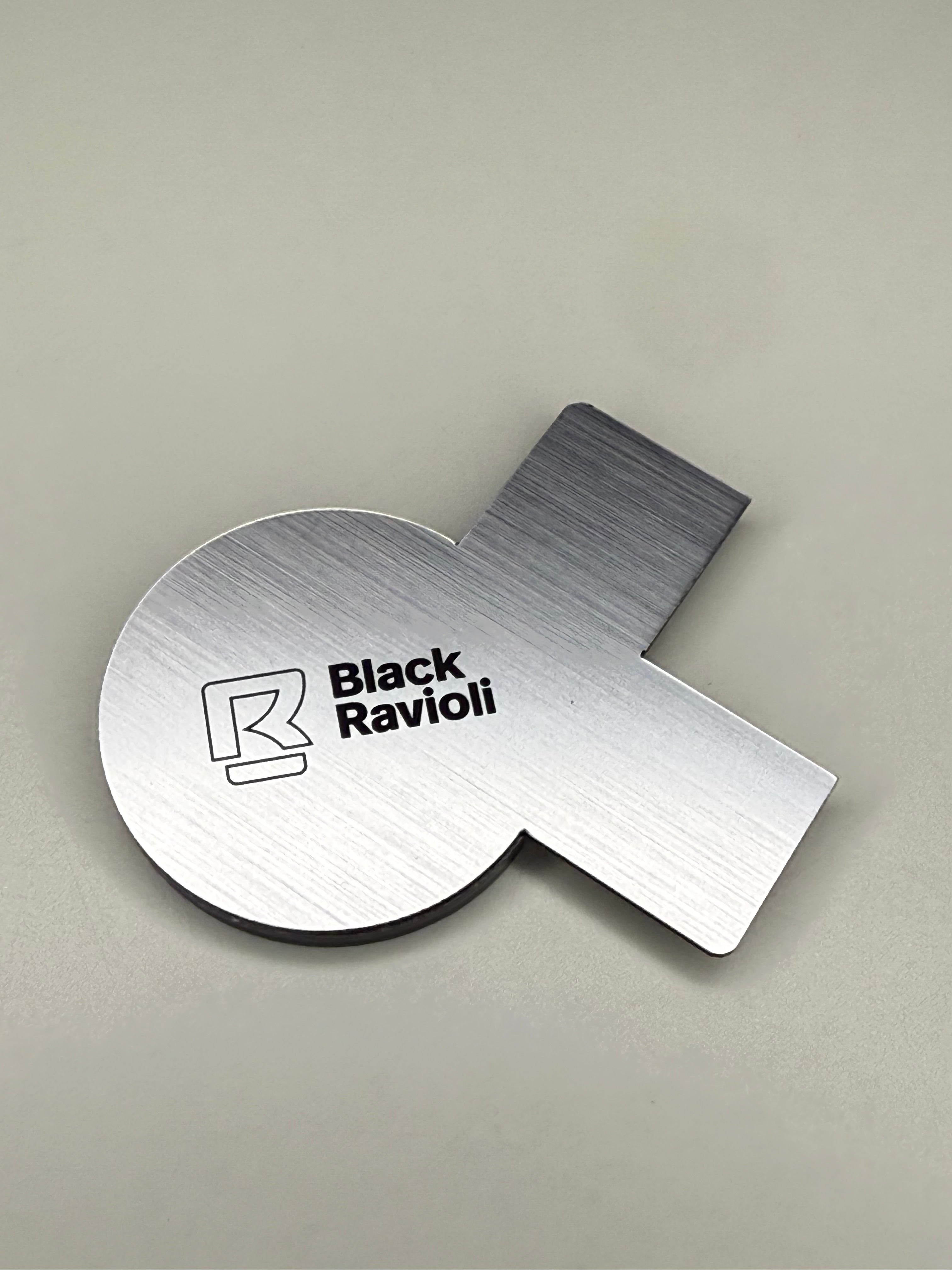 Brushed metal grounding cap and connector piece with Black Ravioli logo